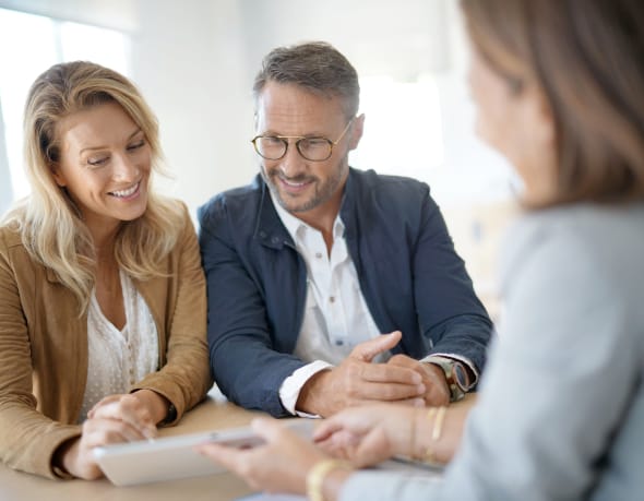 Tenants discussing rental with real estate agent